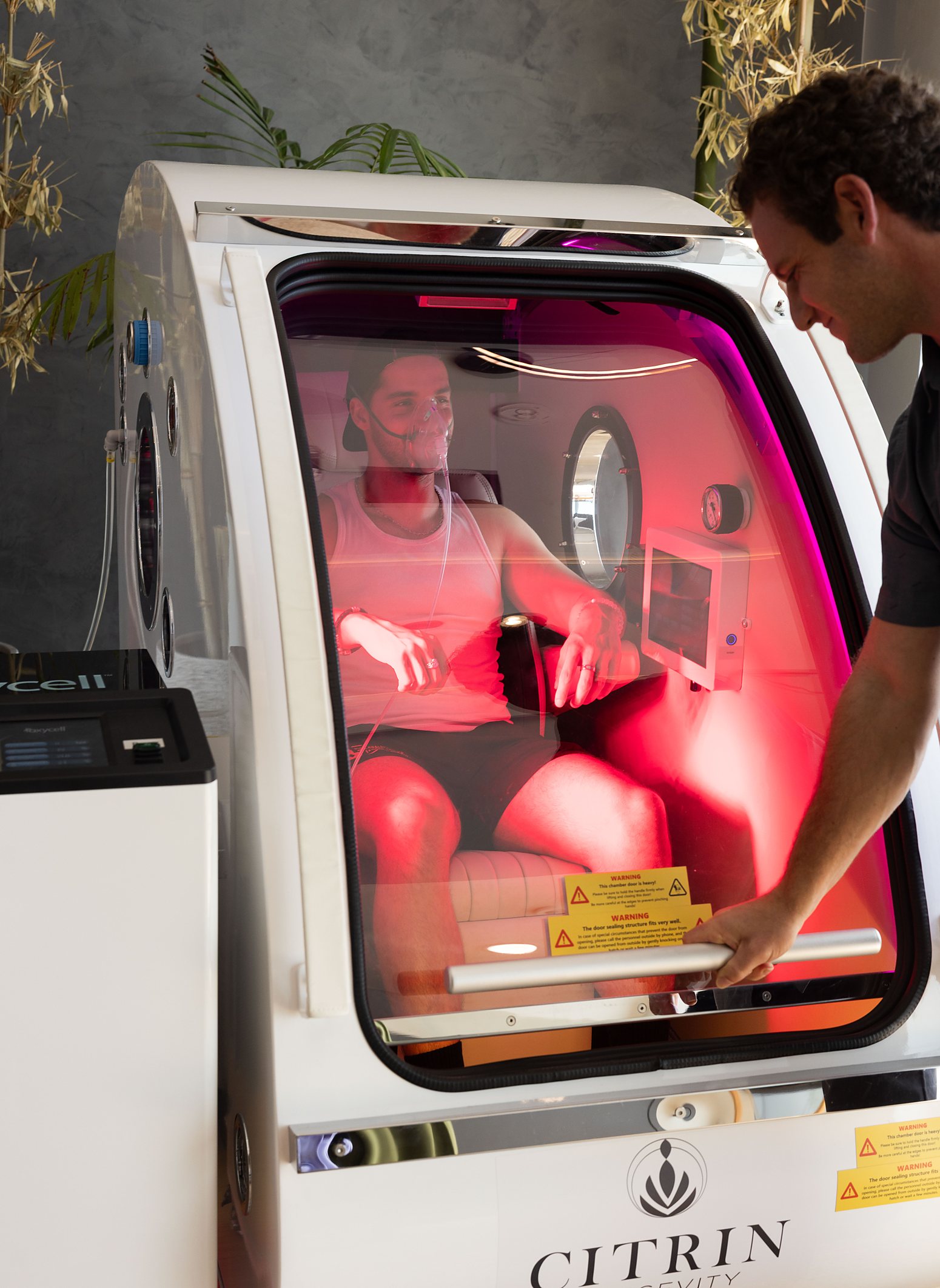 A Citrin Longevity clinician preparing a member for a hyperbaric oxygen session in West Hollywood, Los Angeles
