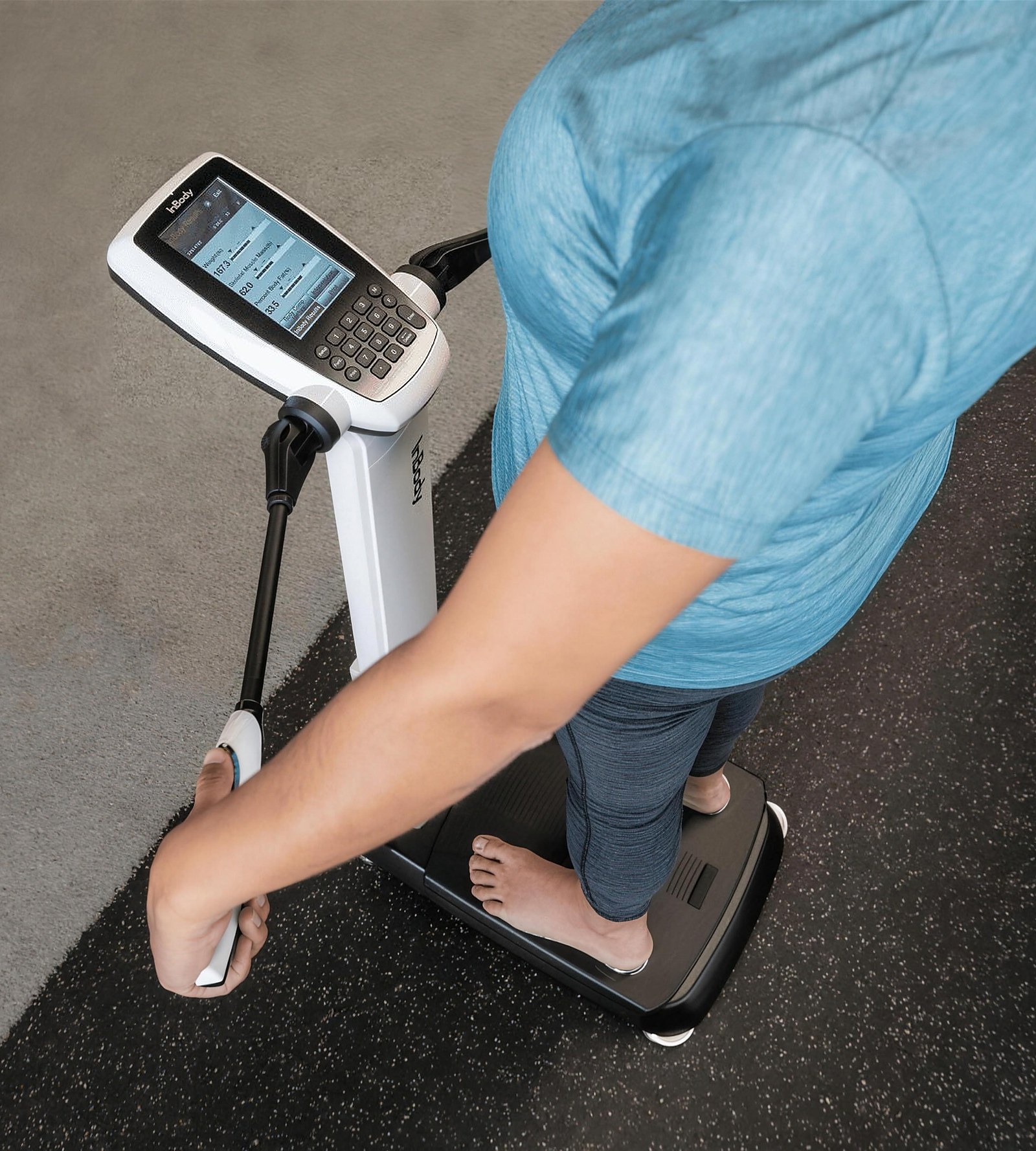 A member stepping onto the InBody 270 analyzer for a body composition scan at Citrin Longevity in West Hollywood, Los Angeles