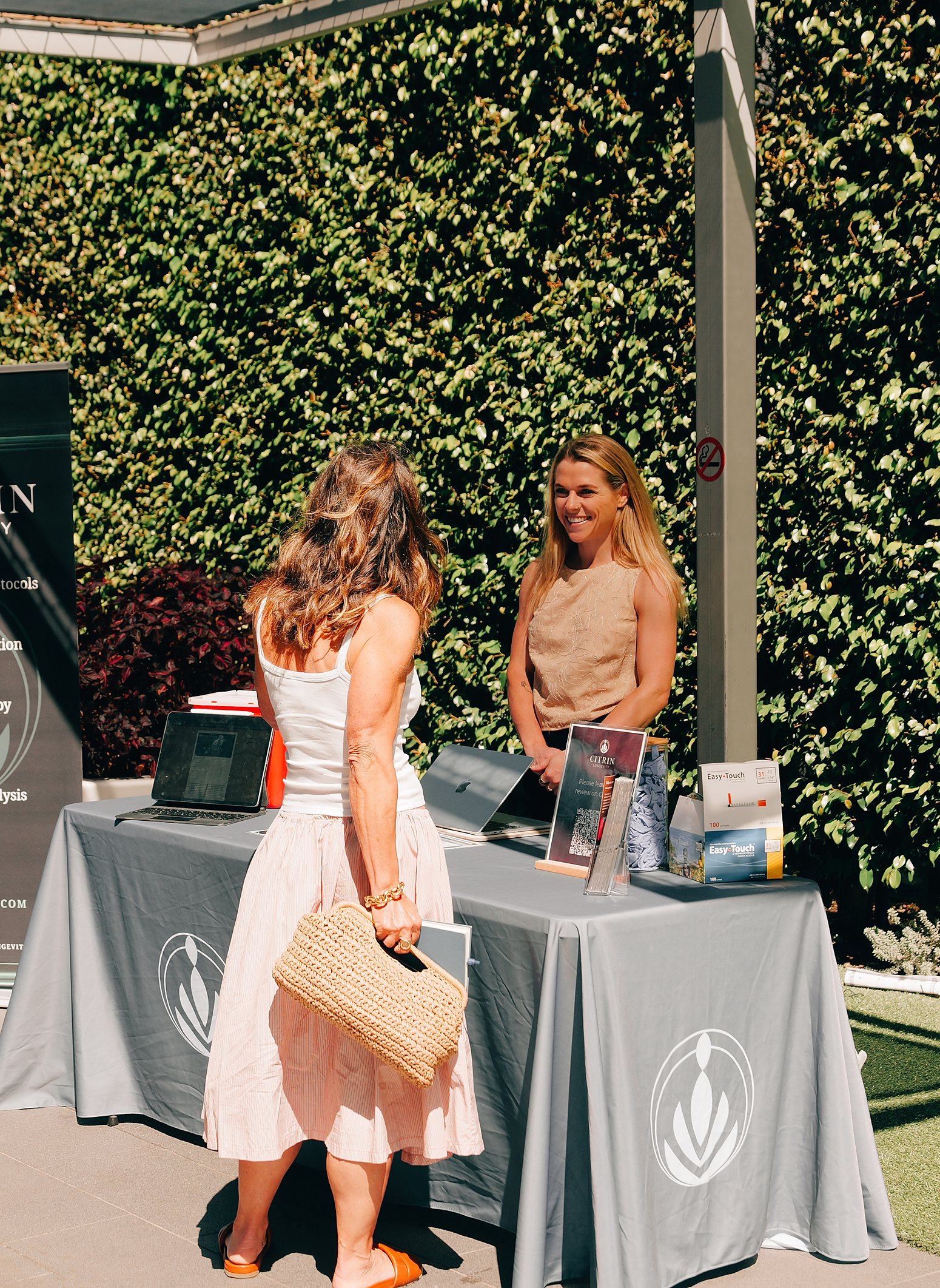 Citrin Longevity team members meeting guests at a community wellness event in West Hollywood, Los Angeles