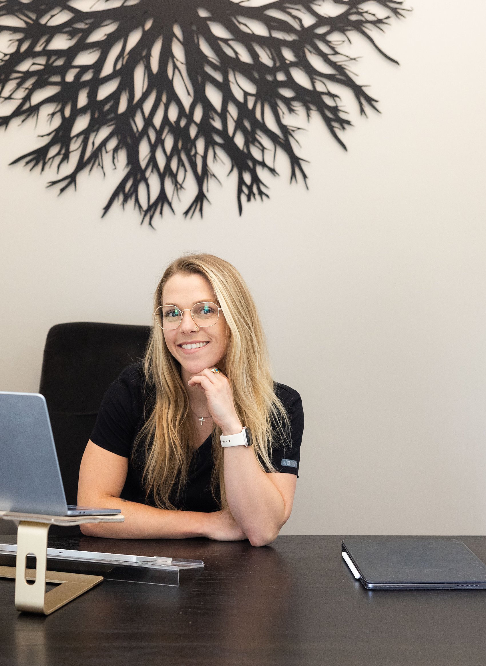 Dr. Haley Moran at her desk reviewing a member's quarterly results, the clinical oversight in the Foundation membership at Citrin Longevity in West Hollywood, Los Angeles