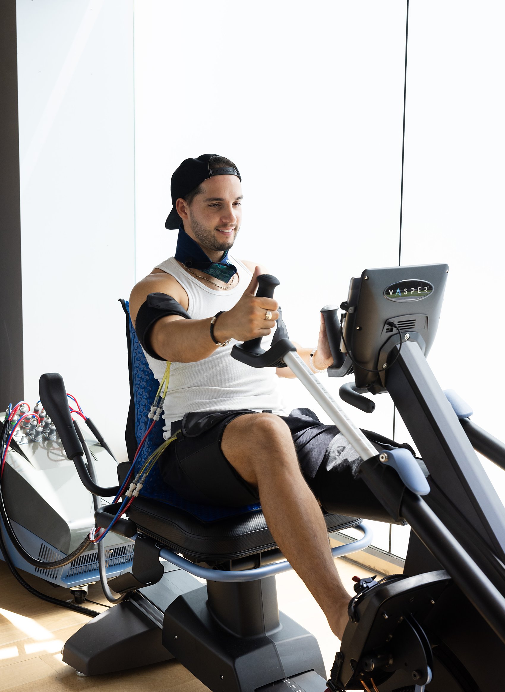 A member mid-interval on the VASPER with cooling compression cuffs at Citrin Longevity in West Hollywood, Los Angeles