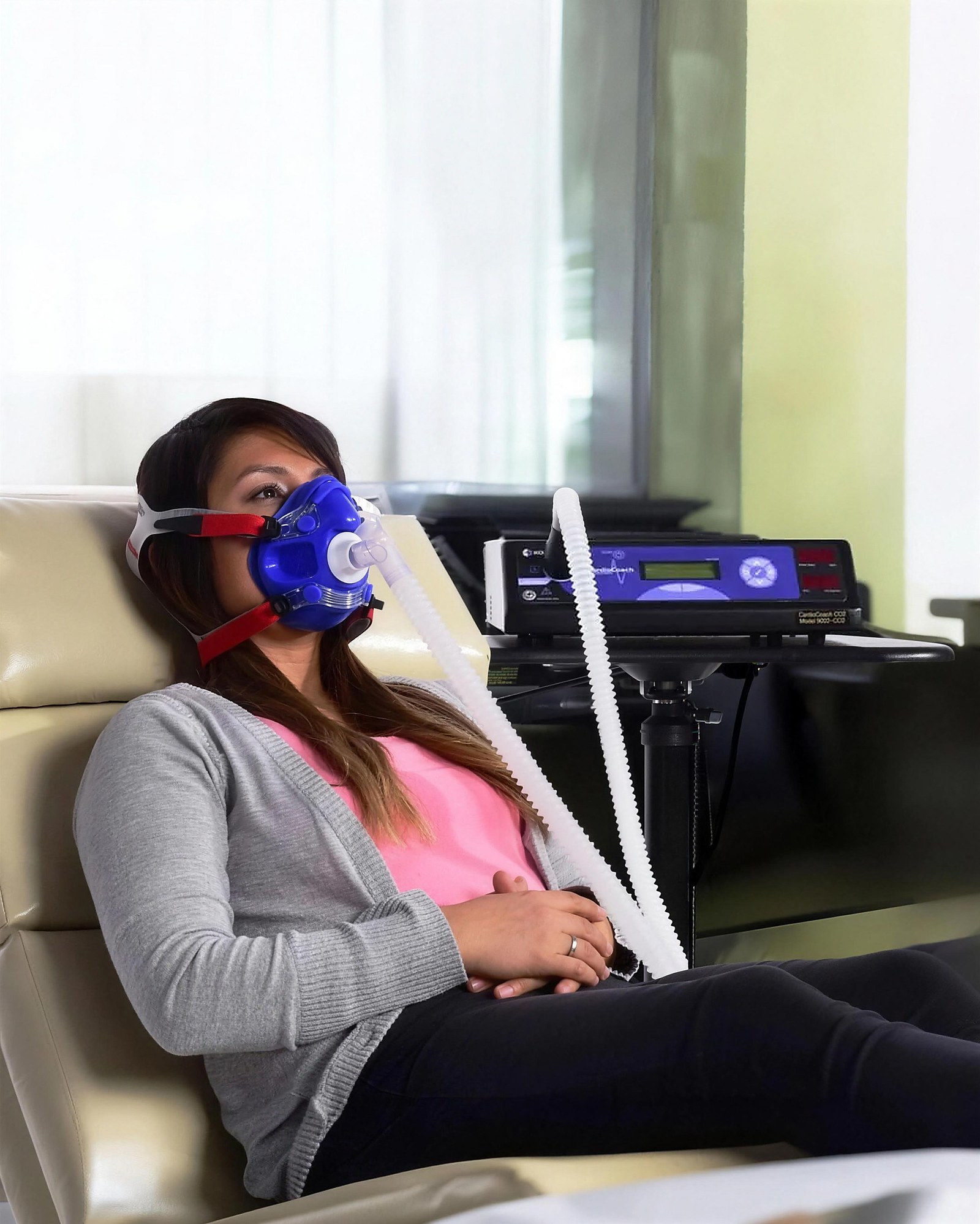 A member reclined for a resting metabolic rate test beside the analyzer at Citrin Longevity in West Hollywood, Los Angeles