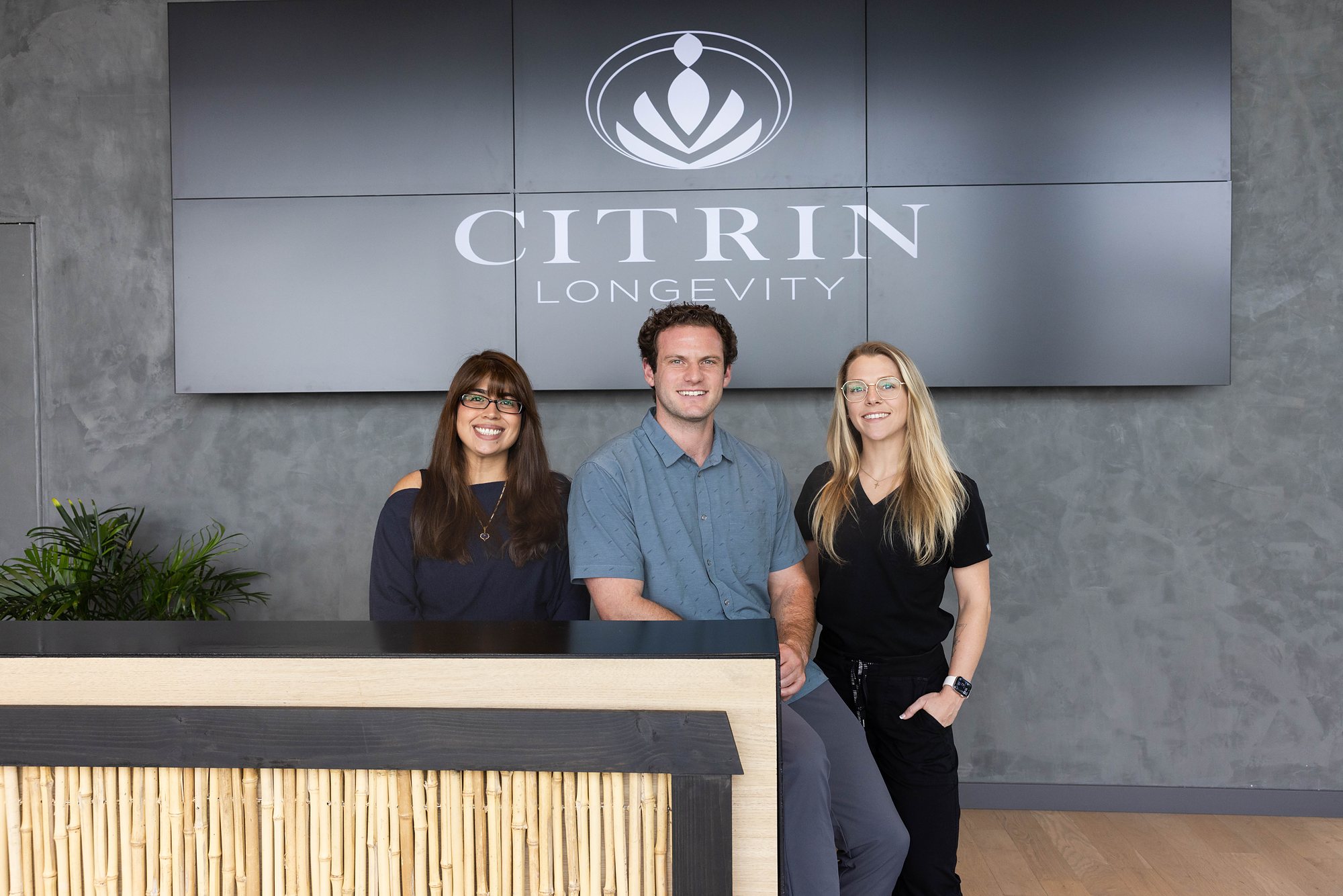 The Citrin Longevity team together at the reception desk of the West Hollywood clinic in Los Angeles