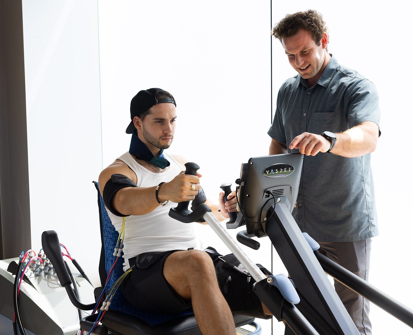 A Citrin Longevity coach setting VASPER console resistance for a member in West Hollywood, Los Angeles