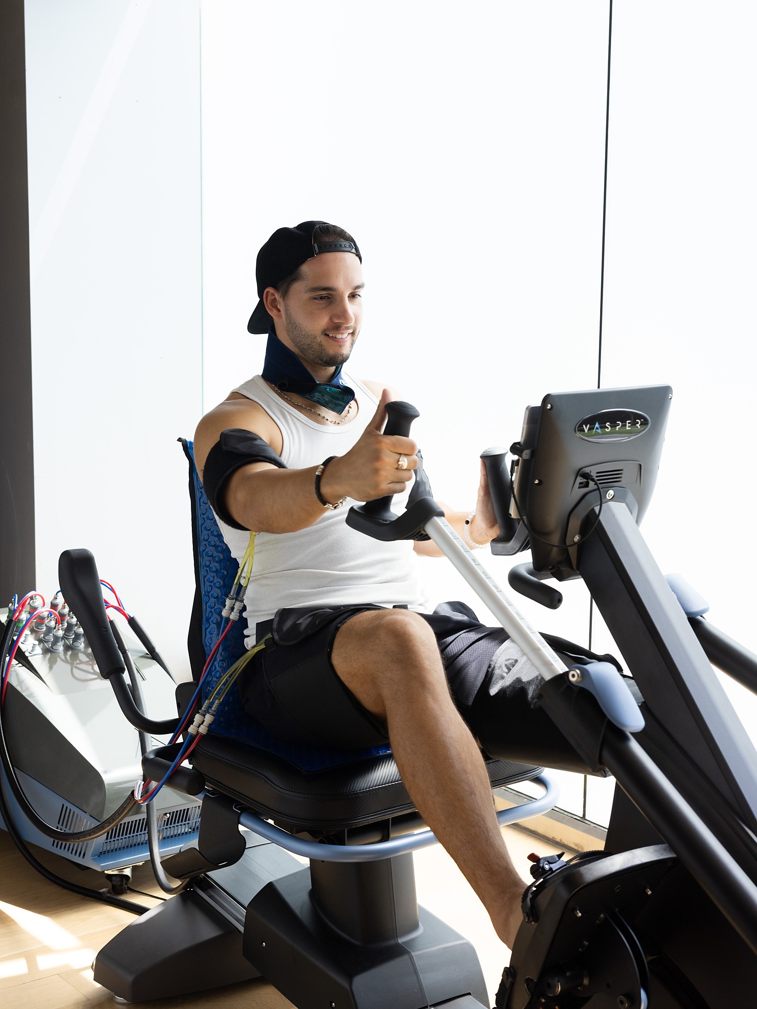 A member mid-interval on the VASPER with cooling compression cuffs at Citrin Longevity in West Hollywood, Los Angeles
