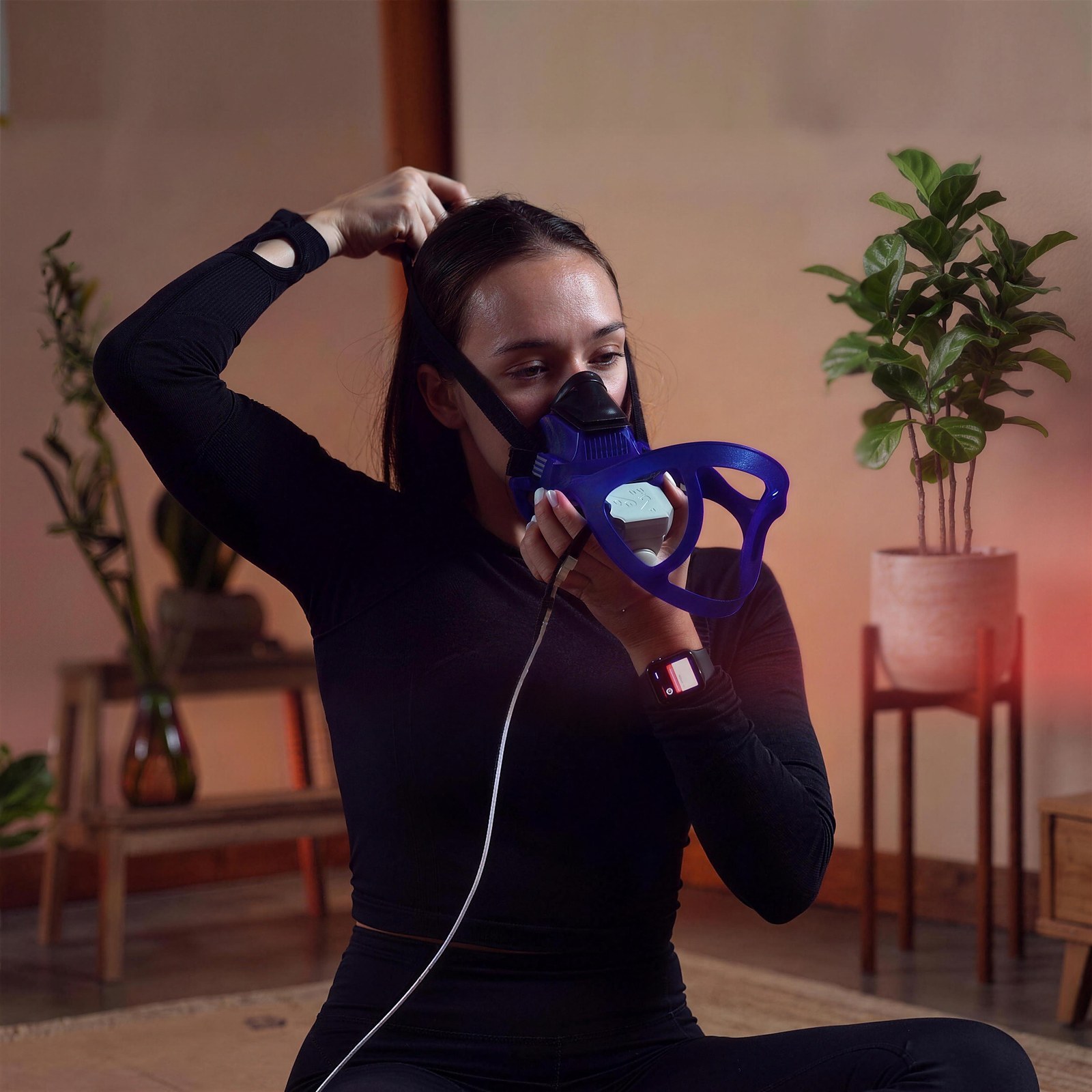 A member fitting the metabolic testing mask before a VO2 max test at Citrin Longevity in West Hollywood, Los Angeles